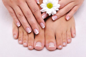 skincare beauty female feet with camomile s flower